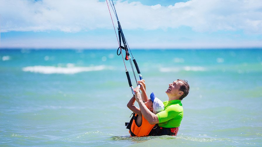 Young boy learning to kitesurf