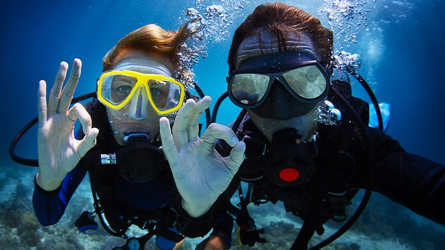 Scuba diving couple under water