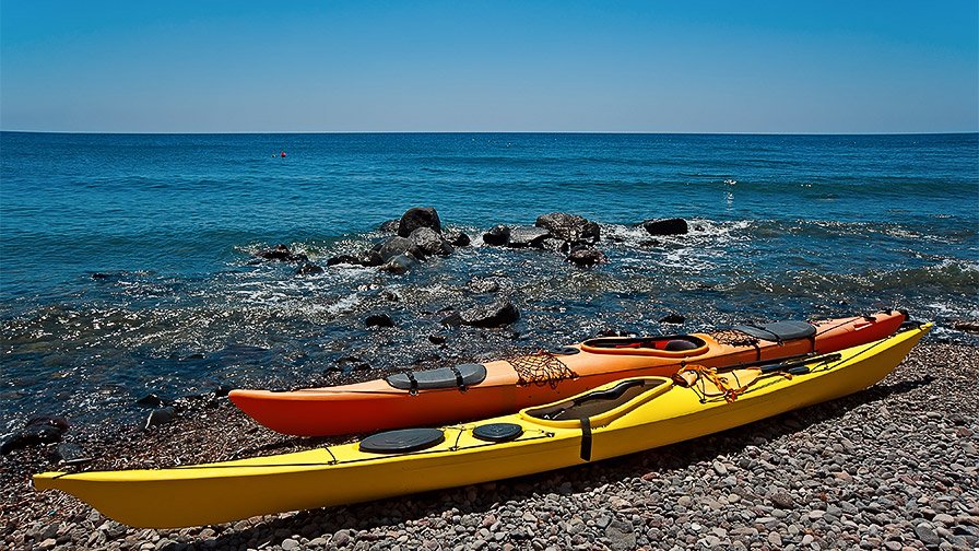 Kayaks on the beach in Santorini Greece